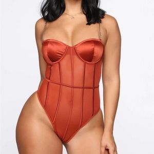 Orange sheer bodysuit gold chain straps